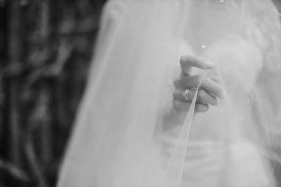 Close-up of hand holding umbrella