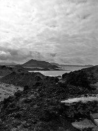 View of beach against cloudy sky