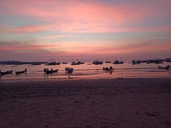 Scenic view of beach against sky during sunset