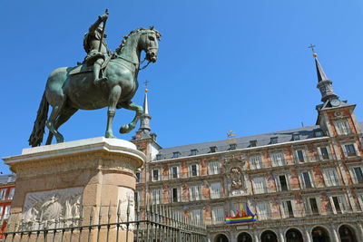 Low angle view of statue against sky