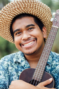 Portrait of man playing guitar