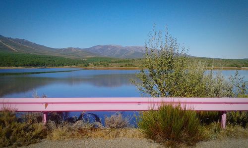 Scenic view of calm lake against clear sky