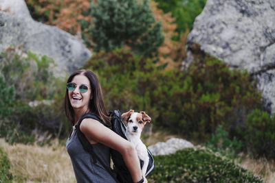 Portrait of young woman with dog
