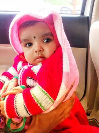 Portrait of cute baby girl in bus