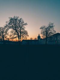 Silhouette of bare tree against clear sky