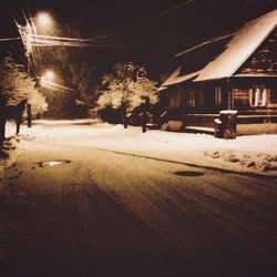 Snow covered trees at night