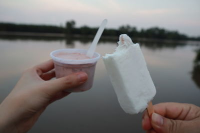 Close-up of hand holding ice cream