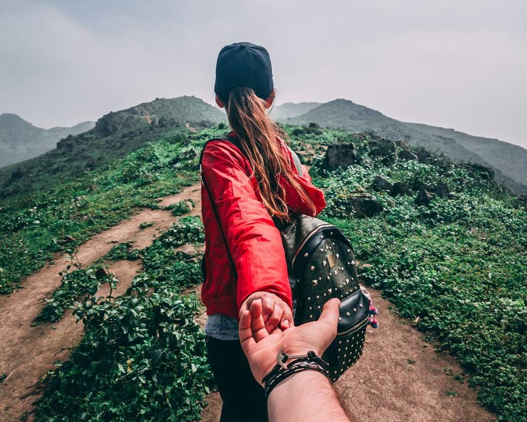 LOW SECTION OF PEOPLE STANDING ON MOUNTAIN