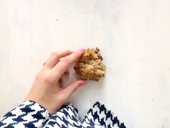 Close-up of hand holding ice cream