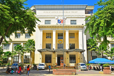 Buildings by street in city