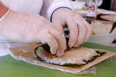 Close-up of man preparing sushi