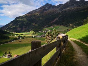 Scenic view of landscape and mountains against sky