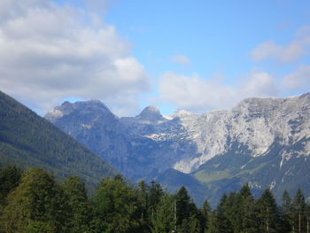 Scenic view of mountains against cloudy sky