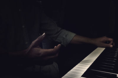 Close-up of man playing guitar