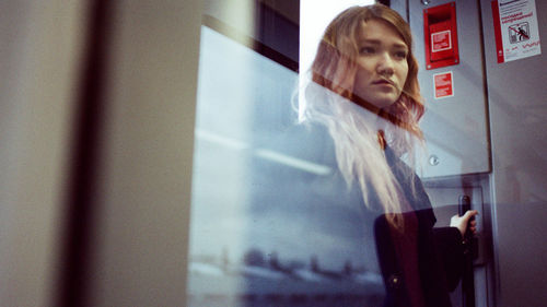 Portrait of a woman standing in a subway