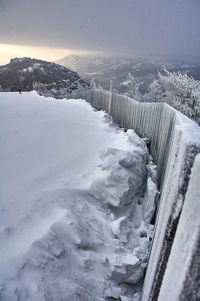 Scenic view of frozen lake against sky