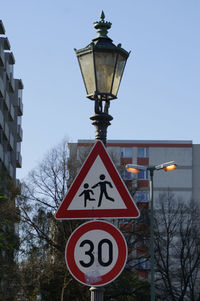 Information sign on street light in city