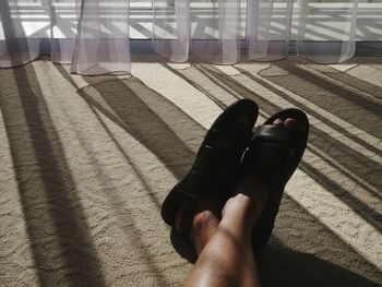 Low section of people standing on tiled floor