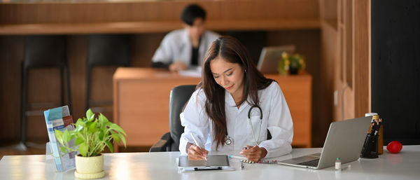 Doctor using laptop at hospital