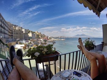 Woman in water against clear sky