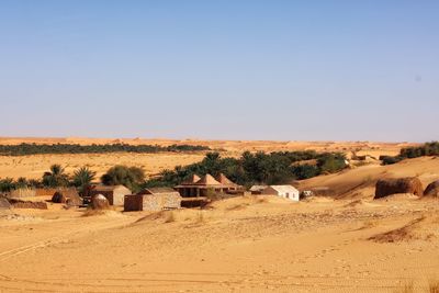 Scenic view of desert against clear sky