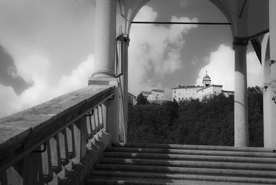 Staircase by building against sky