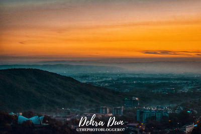 High angle view of townscape against sky during sunset