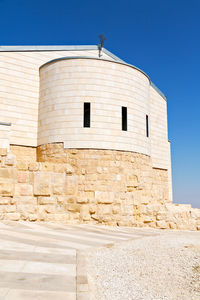 Low angle view of building against blue sky