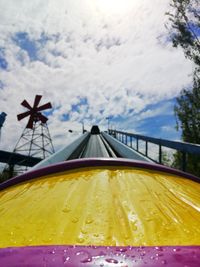 Close-up of yellow water against sky
