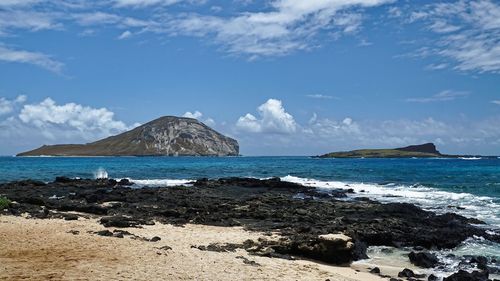 Scenic view of sea against blue sky