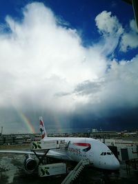 View of rainbow against cloudy sky