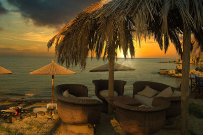 Scenic view of beach against sky during sunset