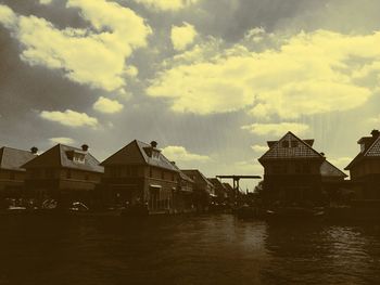 Built structures against cloudy sky