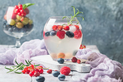 Close-up of strawberries on glass table