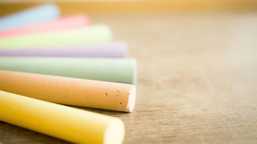 Close-up of multi colored pencils on table