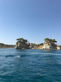 Scenic view of sea against clear blue sky