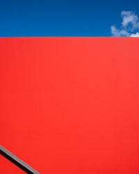 Low angle view of red wall
