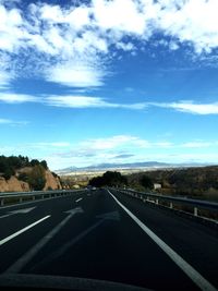 Empty road passing through landscape