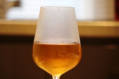 Close-up of beer glass on table