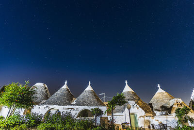 Panoramic view of historic building against sky at night