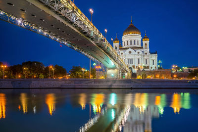 Reflection of illuminated buildings in water at night