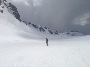 Person standing on snow covered landscape