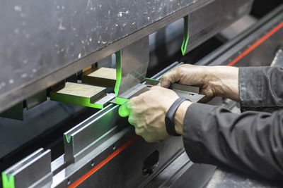 Cropped hand of man working in workshop