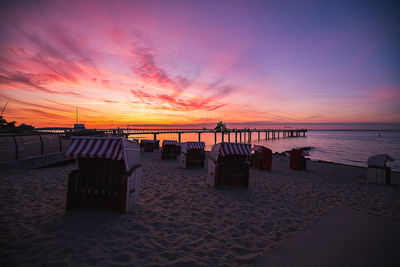 Scenic view of sea against romantic sky at sunset