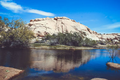 Scenic view of mountain against blue sky