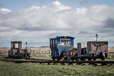 Train on railroad track against sky