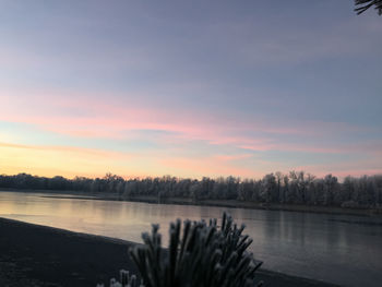 Scenic view of lake against sky during sunset