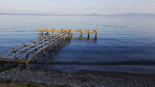 Pier on sea against sky