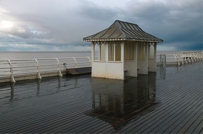 Built structure on beach against sky