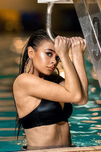 Portrait of sensuous woman in swimming pool